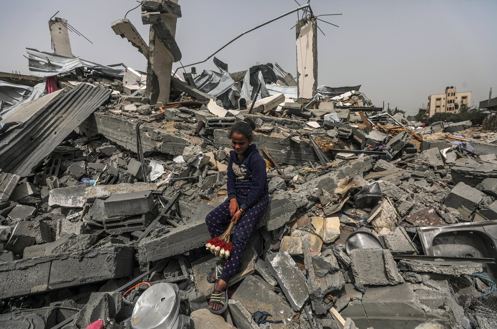 A Palestinian girl sits among the rubble of a house after returning to Al Nusairat refugee camp following the Israeli army&#039;s retreat from the area, Gaza Strip, Palestine, April 18, 2024. (EPA Photo)