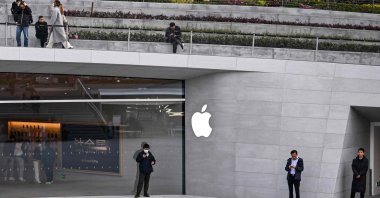 People stand outside a recently opened Apple Store in Shanghai's Jing'an district, China, March 26, 2024. (AFP Photo)