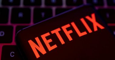 A smartphone with a Netflix logo is placed on a keyboard in this illustration taken on April 19, 2022. (Reuters Photo)