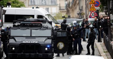 French police and members of French special police forces of the Research and Intervention Brigade (BRI) secure the area near the Iran consulate where a man is threatening to blow himself up, in Paris, France, April 19, 2024. (Reuters Photo)