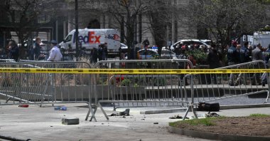 Police crime tape is strung at the site across from Manhattan Criminal Court in New York City after a man reportedly set himself on fire during the trial of U.S. President Donald Trump, April 19, 2024. (AFP Photo)