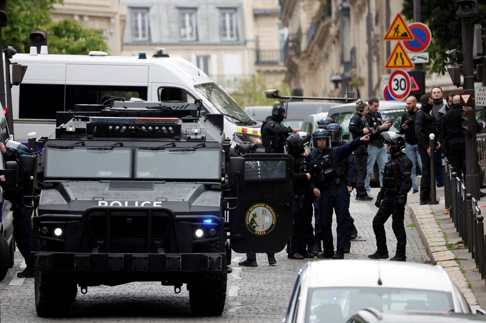 French police and members of French special police forces of the Research and Intervention Brigade (BRI) secure the area near the Iran consulate where a man is threatening to blow himself up, in Paris, France, April 19, 2024. (Reuters Photo)