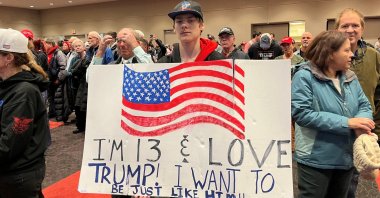 A young Donald Trump supporter holds up a sign, at a Trump rally in Green Bay, Wisconsin, U.S., April 2, 2024. (Reuters Photo)