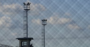 A prison guard sits in a watchtower at the Pinero jail, Pinero, Argentina, April 9, 2024. (AP Photo)