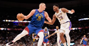 Denver Nuggets Nikola Jokic (L) drives to the basket against Los Angeles Lakers Rui Hachimura during the second quarter in game one of the first round for the 2024 NBA playoffs at Ball Arena, Denver, Colorado, U.S., April 20, 2024. (Reuters Photo)