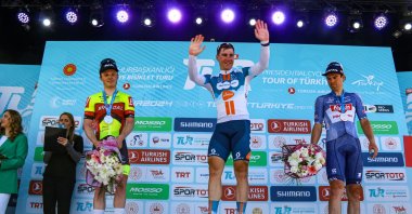 The 134.7-kilometer Antalya-Antalya stage of the Presidential Tour of Türkiye winner Fabio Jakobsen (C) celebrates at the podium, Antalya, Türkiye, April 21, 2024. (IHA Photo)

