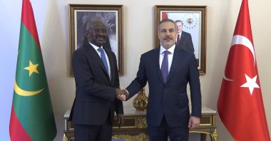 Foreign Minister Hakan Fidan (R) shakes hands with Mauritanian Foreign Minister Mohamed Salem Ould Merzoug after a meeting, Istanbul, Türkiye, April 21, 2024. (DHA Photo)