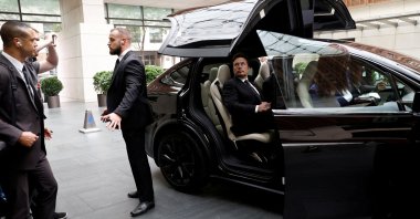 Tesla Chief Executive Officer Elon Musk gets in a Tesla car as he leaves a hotel, Beijing, China, May 31, 2023. (Reuters Photo)