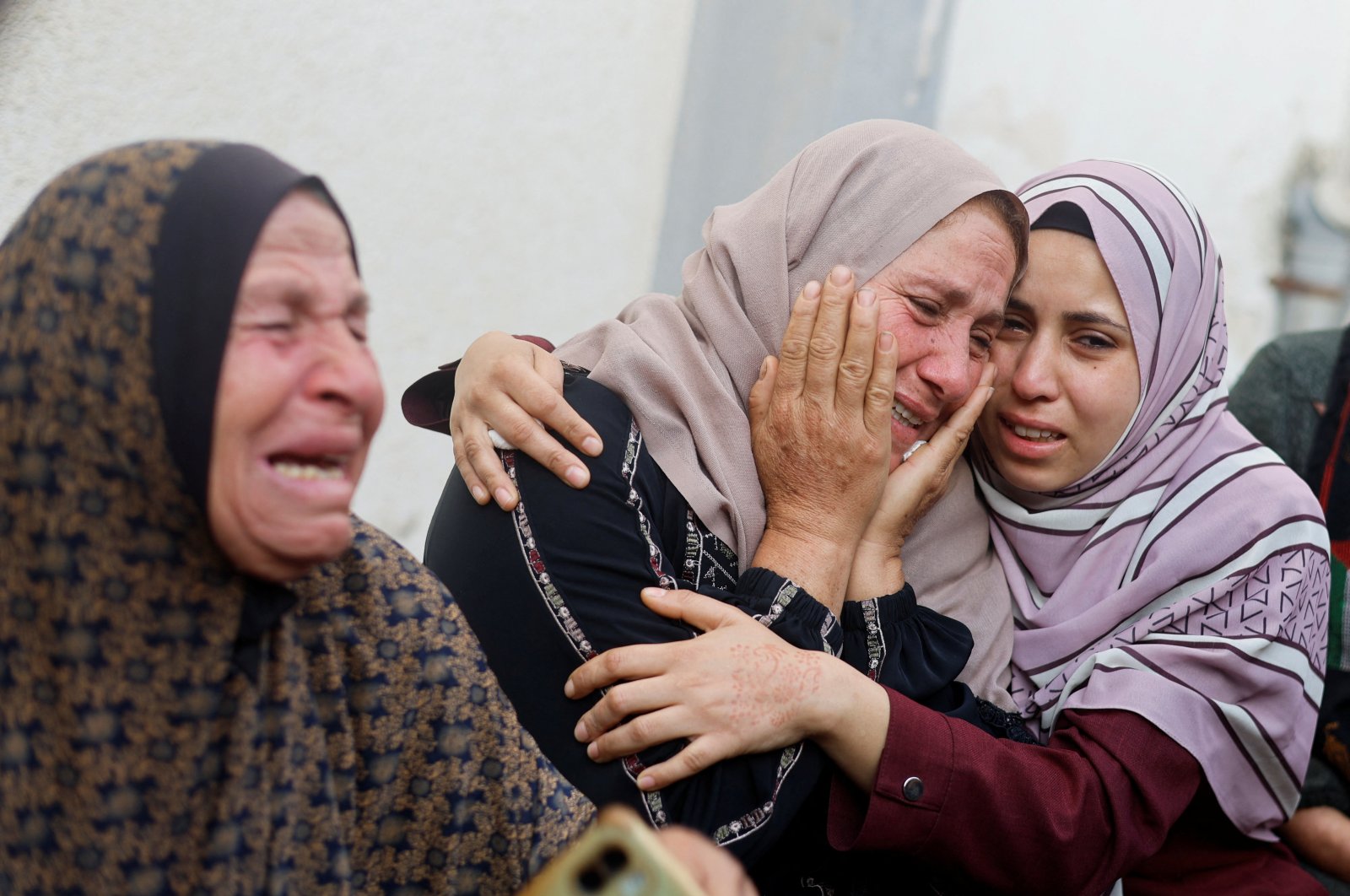Women mourn near the bodies of Palestinians killed in Israeli strikes amid the ongoing Israeli attacks on Gaza, Rafah, Palestine, April 21, 2024. (Reuters Photo)