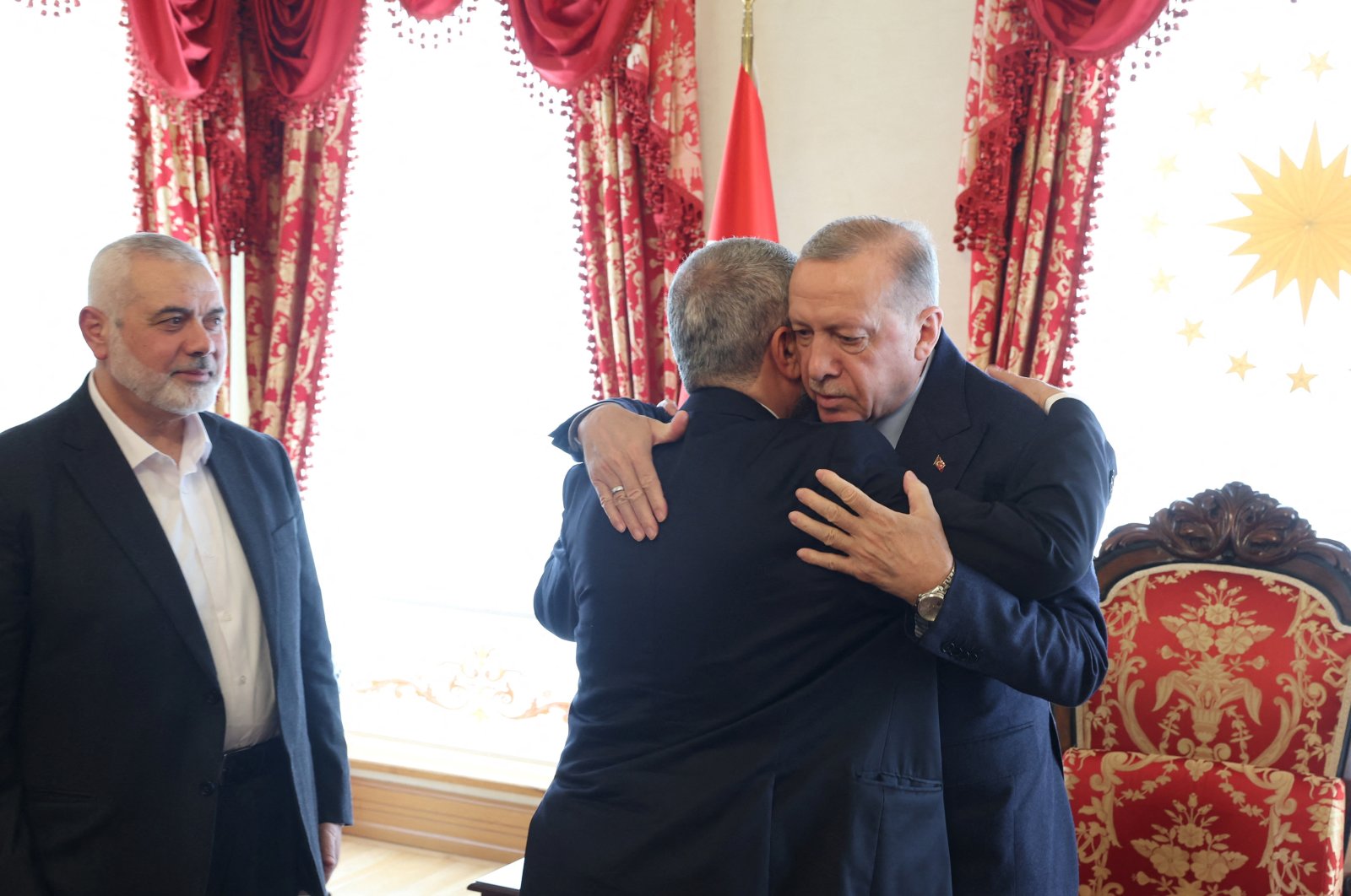 President Recep Tayyip Erdoğan (R) welcomes Hamas senior official Khaled Meshaal as Ismail Haniyeh, leader of the Palestinian resistance group Hamas, looks on during a meeting in Istanbul, Türkiye, April 20, 2024. (Reuters Photo)