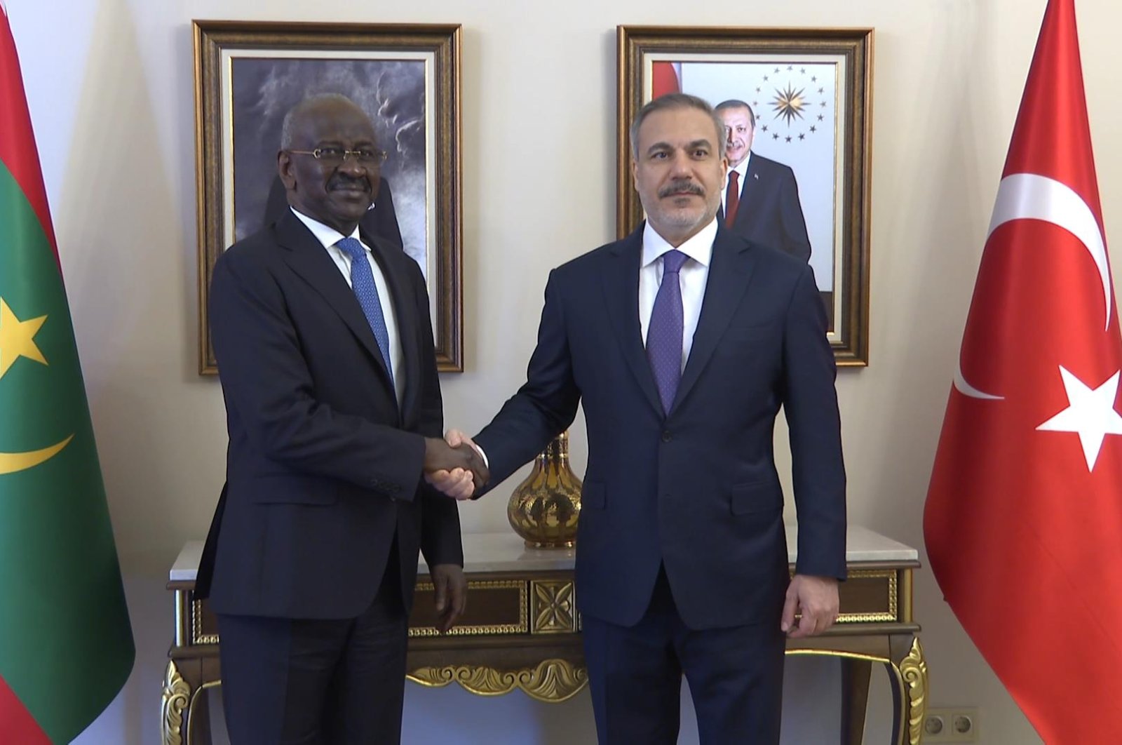 Foreign Minister Hakan Fidan (R) shakes hands with Mauritanian Foreign Minister Mohamed Salem Ould Merzoug after a meeting, Istanbul, Türkiye, April 21, 2024. (DHA Photo)