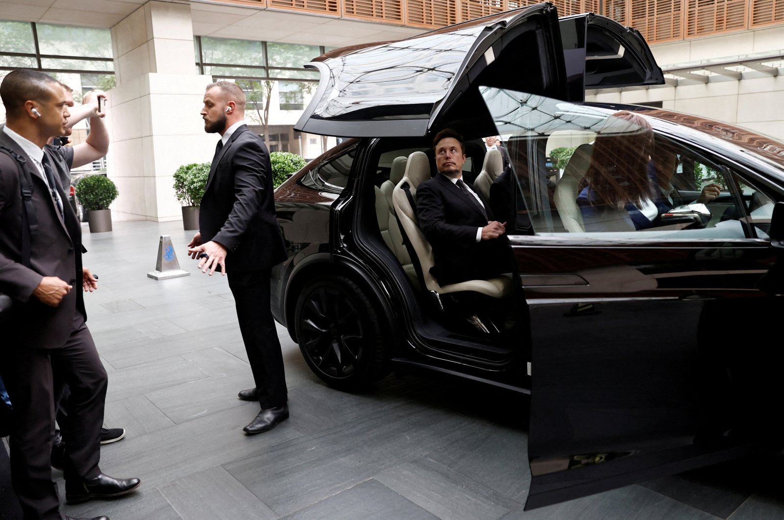 Tesla Chief Executive Officer Elon Musk gets in a Tesla car as he leaves a hotel, Beijing, China, May 31, 2023. (Reuters Photo)