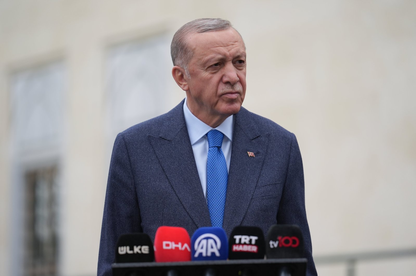 President Recep Tayyip Erdoğan talks to reporters following Friday prayers in Istanbul, Türkiye, April 19, 2024. (AA Photo) 