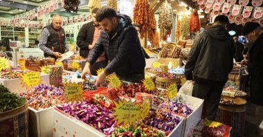 A trader and costumers conduct business at a historic bazaar in eastern Elazığ province, Türkiye, April 9, 2024. (IHA Photo)