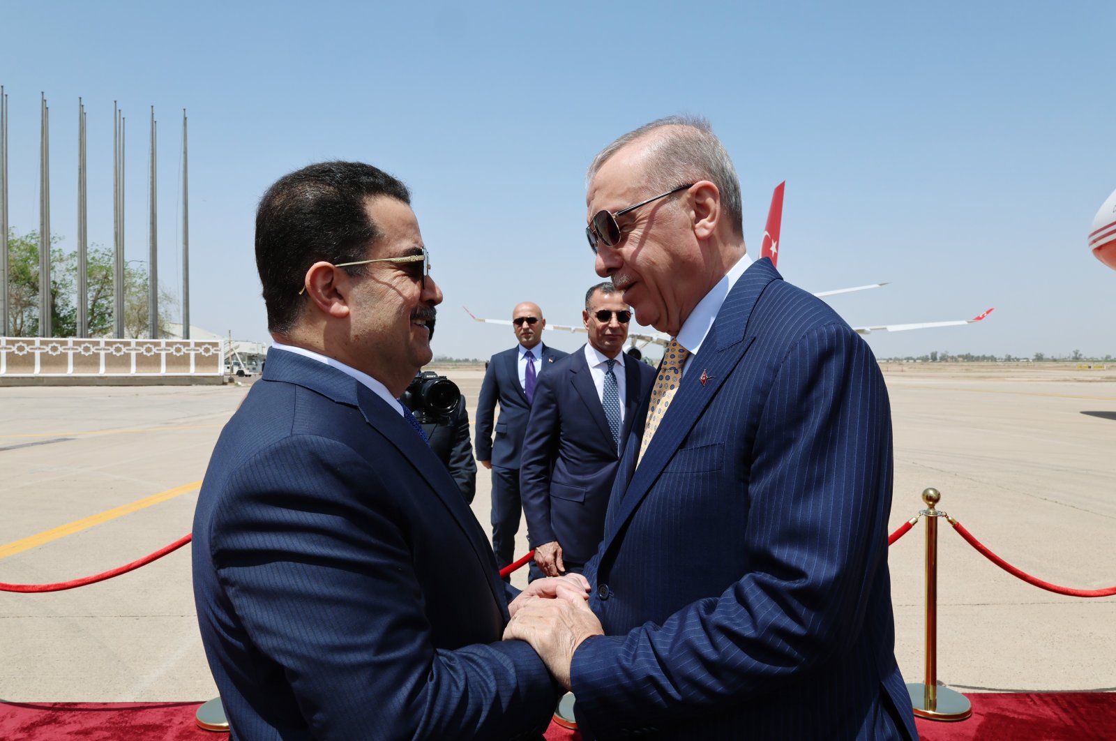 Iraqi Prime Minister Mohammed S. Al Sudani (L) shakes hands with President Recep Tayyip Erdoğan (R) as he welcomes the Turkish leader at Baghdad Airport, Baghdad, Iraq, Aprli 22, 2024. (IHA Photo)
