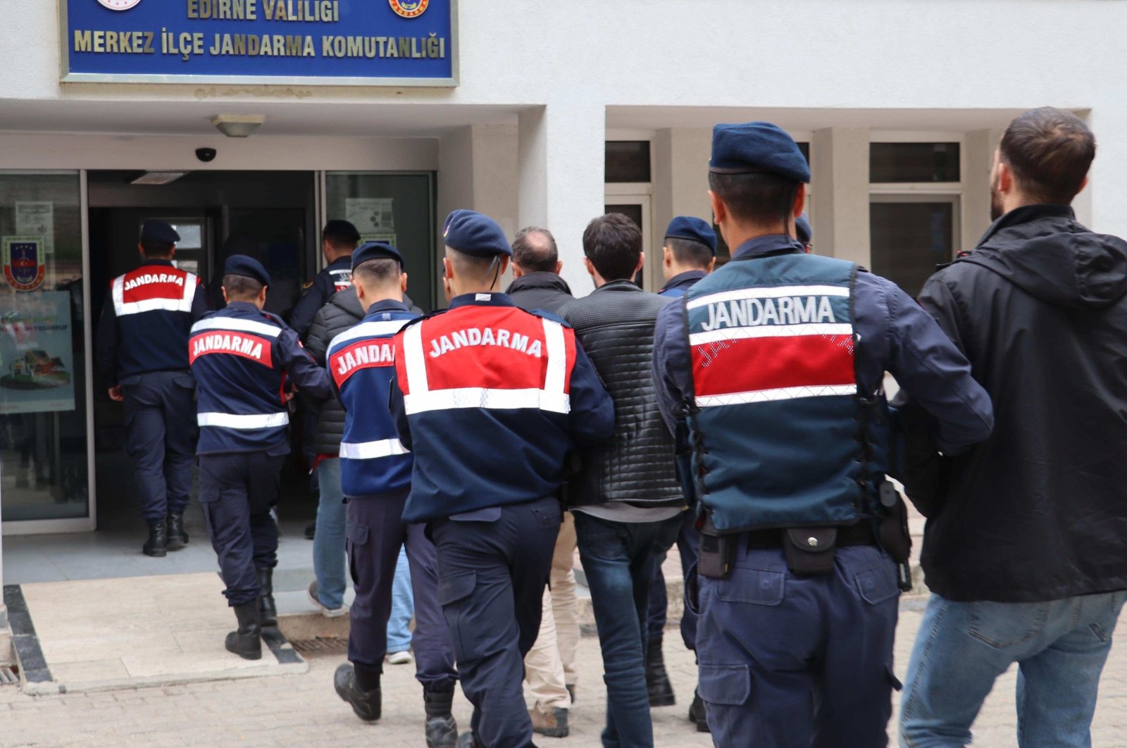 Turkish gendarmerie escort to the courthouse seven suspected terrorists, including four FETÖ members caught trying to flee abroad in northwestern Edirne province, Türkiye, April 18, 2024. (AA Photo)