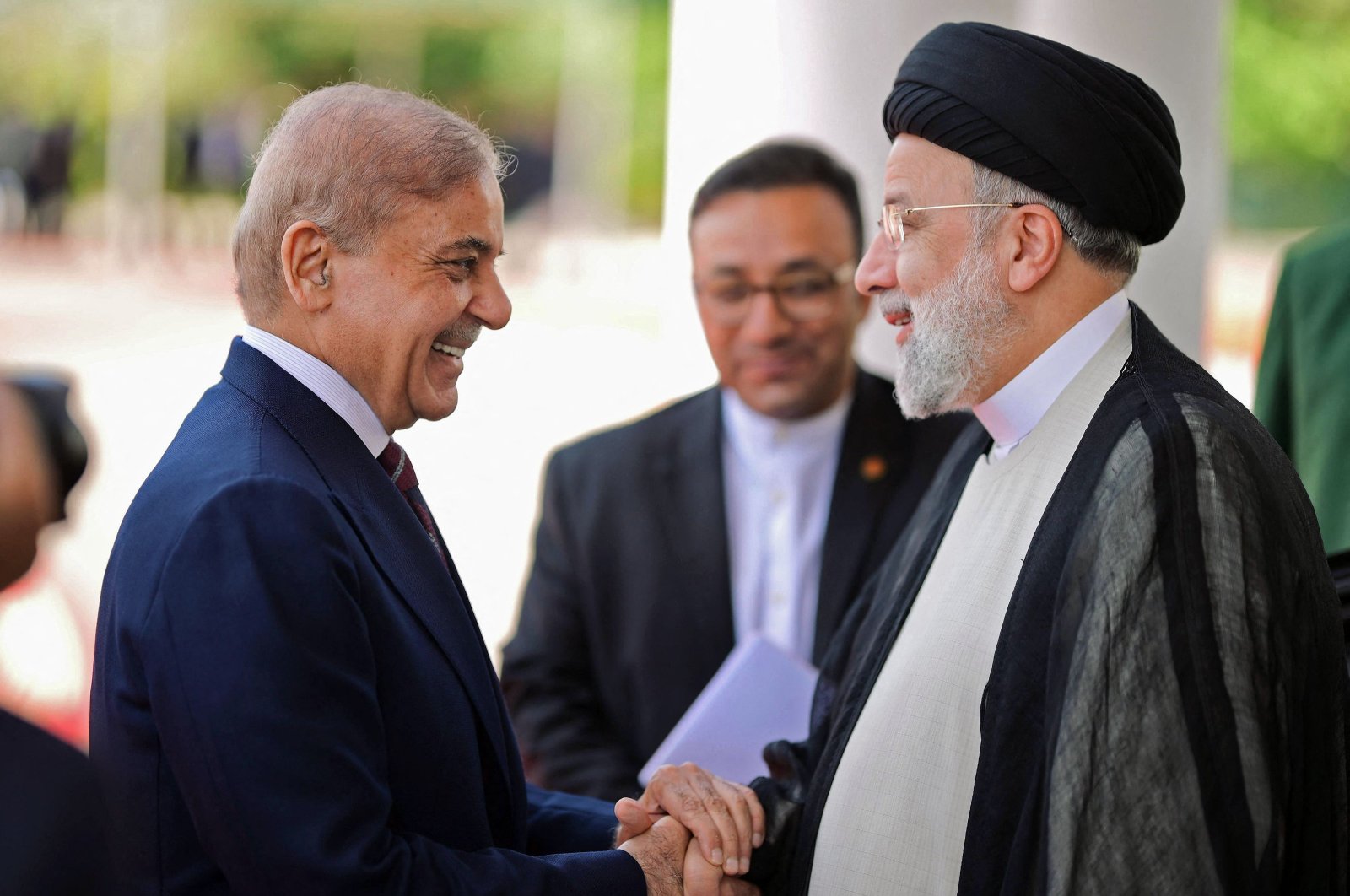 Iran’s President Ebrahim Raisi (R) being greeted by Pakistan&#039;s Prime Minister Shehbaz Sharif in Islamabad, Pakistan, April 22, 2024. (AFP Photo)