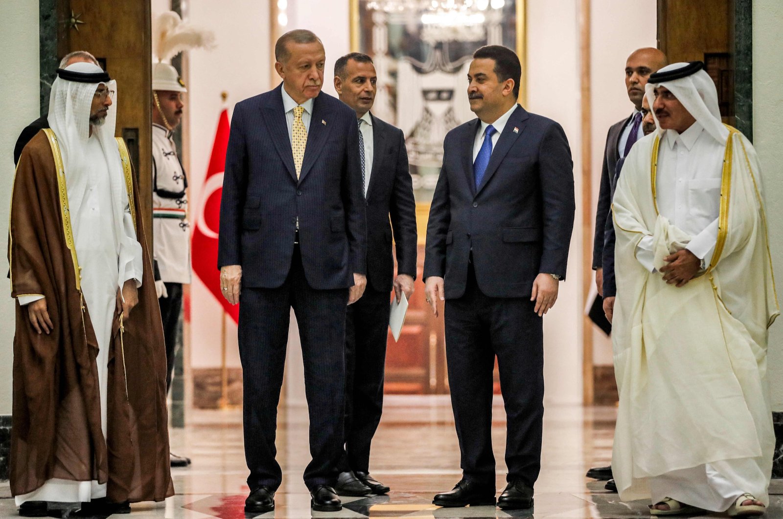 President Recep Tayyip Erdoğan (2nd L) and Prime Minister Mohammed S. Al Sudani (2nd-R) pose ahead of their meeting, Baghdad, Iraq, April 22, 2024. (AFP Photo)