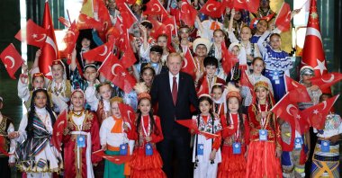 President Recep Tayyip Erdoğan (C) poses with children visiting for a ceremony to mark National Sovereignty and Children&#039;s Day in Ankara, Türkiye, April 23, 2024. (AA Photo)