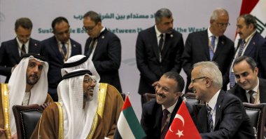 UAE Energy Minister Suhail Mohamed al-Mazrouei (L) and Transport and Infrastructure Minister Abdulkadir Uraloglu (R) speak during the signing of the Development Road framework agreement on security, economy and development, Baghdad, Iraq, April 22, 2024. (EPA Photo)
