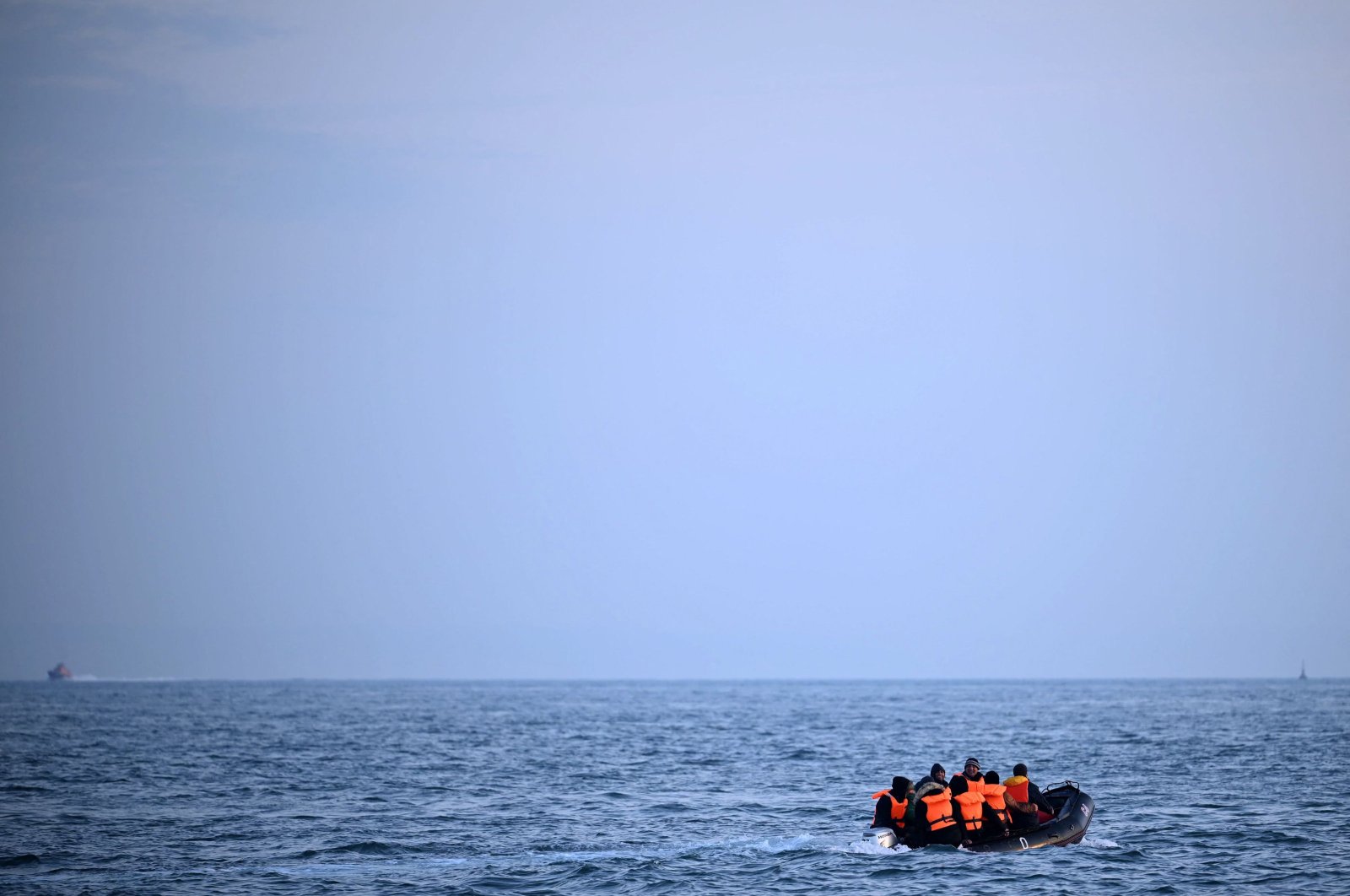 This undated photo shows a group of migrants travel in an inflatable boat across the English Channel bound for Dover, southern coast of England. (AFP Photo)