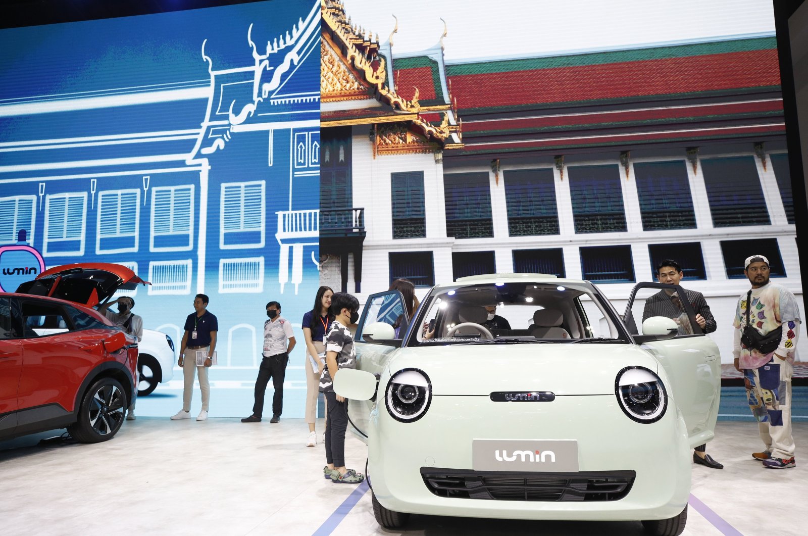Visitors check Chinese automaker Changan&#039;s Lumin electric city cars displayed at the 45th Bangkok International Motor Show 2024, Nonthaburi province, Bangkok, Thailand, March 28, 2024. (EPA Photo)