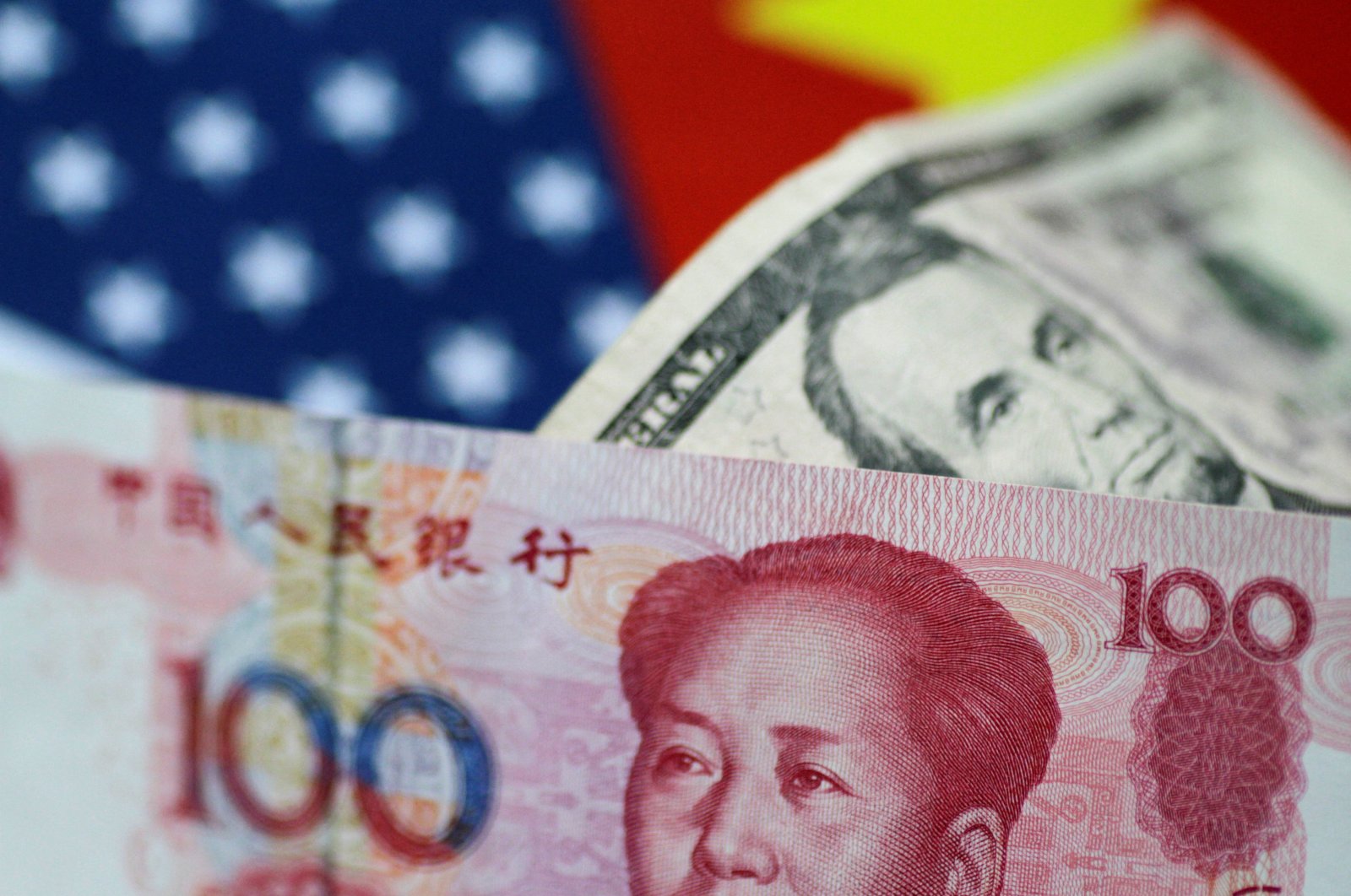 U.S. dollar and China yuan notes are seen in this picture illustration on June 2, 2017. (Reuters Photo)