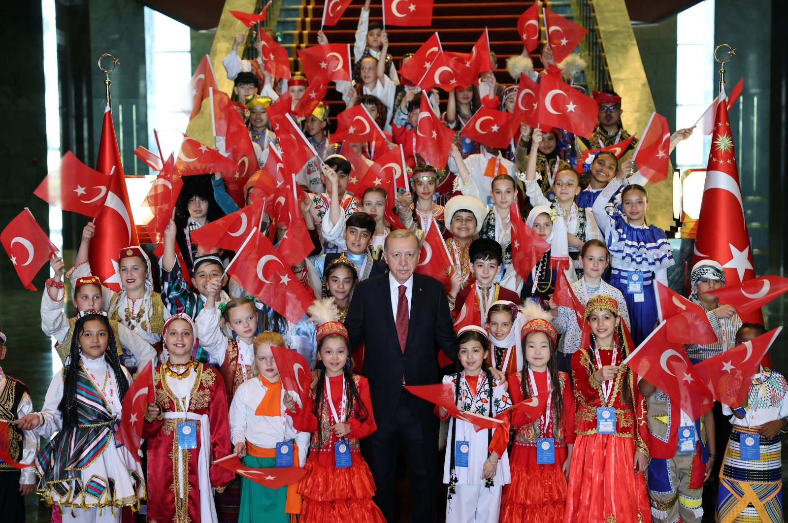 President Recep Tayyip Erdoğan (C) poses with children visiting for a ceremony to mark National Sovereignty and Children&#039;s Day in Ankara, Türkiye, April 23, 2024. (AA Photo)