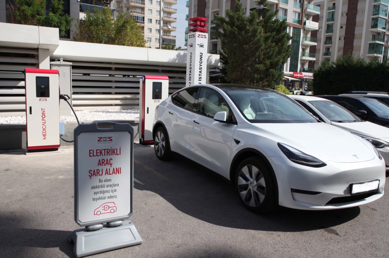 A Tesla model is photographed charging within the complex of Medical Point Hospital at an undisclosed location, Türkiye, April 14, 2024. (AA Photo)