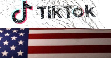 The U.S. flag and TikTok logo are seen through broken glass in this illustration taken March 20, 2024. (Reuters Photo)