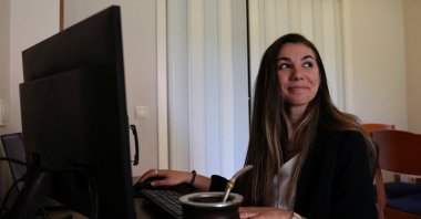 Argentinian postdoctoral researcher in distributed systems Marianela Morales poses for a portrait at her work station in her Madrid home, Spain, April 19, 2024. (Reuters Photo)