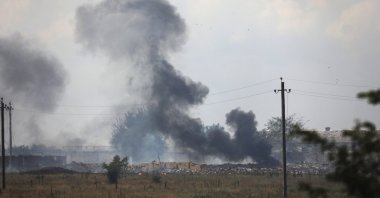 Smoke rises over the site of an explosion at an ammunition storage of the Russian army near the village of Mayskoye, Crimea, Tuesday, Aug. 16, 2022.  (AP File Photo)