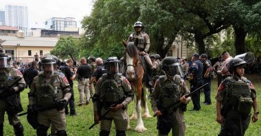 Texas State Troopers and other members of law enforcement monitor the scene as pro-Palestinian students protest Israel's massacres on the campus of the University of Texas in Austin, Texas, on April 24, 2024. (AFP Photo)