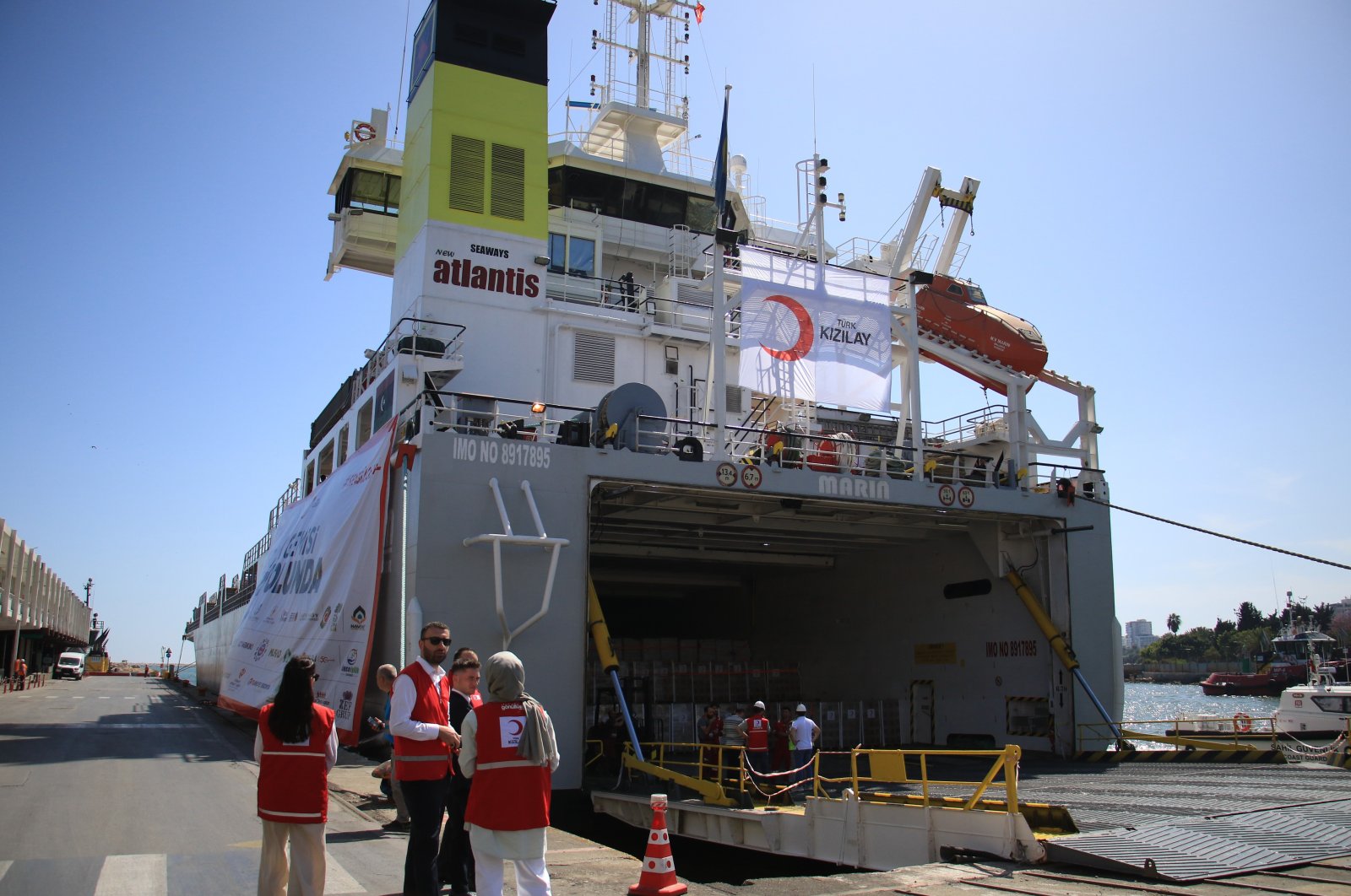 Turkish Red Crescent (Kızılay) staff see off an aid vessel destined for Gaza, Mersin, southern Türkiye, April 16, 2024. (İHA Photo)