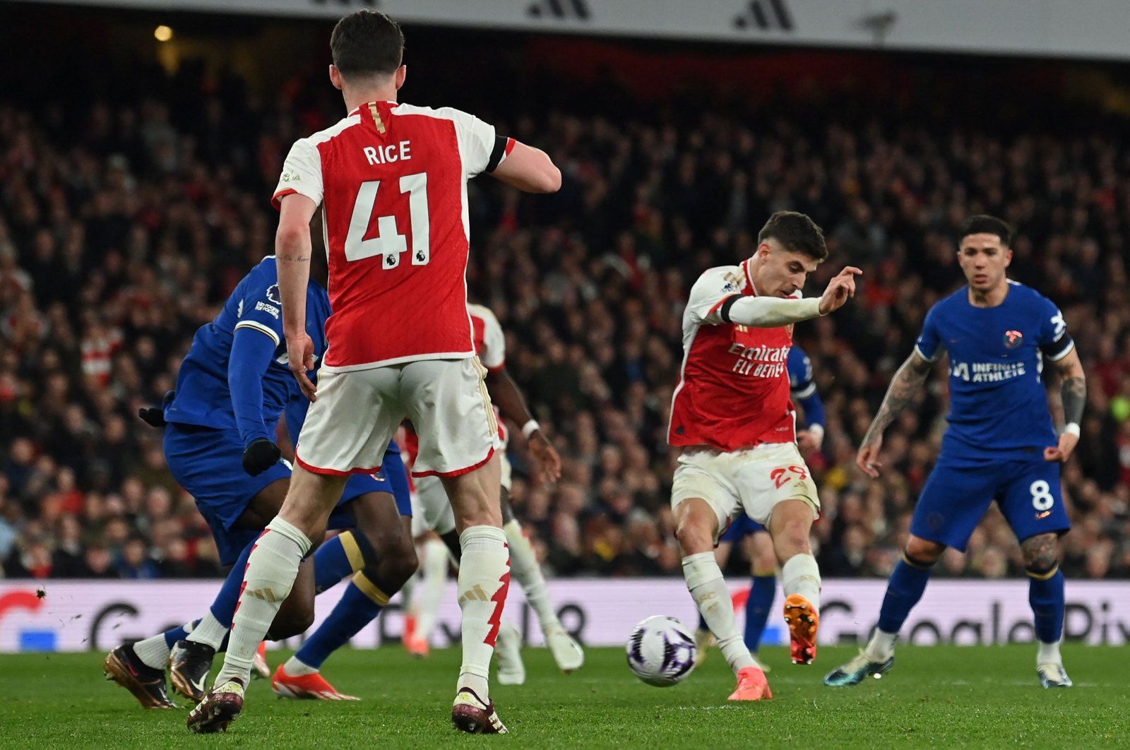 Arsenal&#039;s Kai Havertz (2nd R) shoots to score their fourth goal during the English Premier League football match against Chelsea at the Emirates Stadium, London, U.K., April 23, 2024. (AFP Photo)