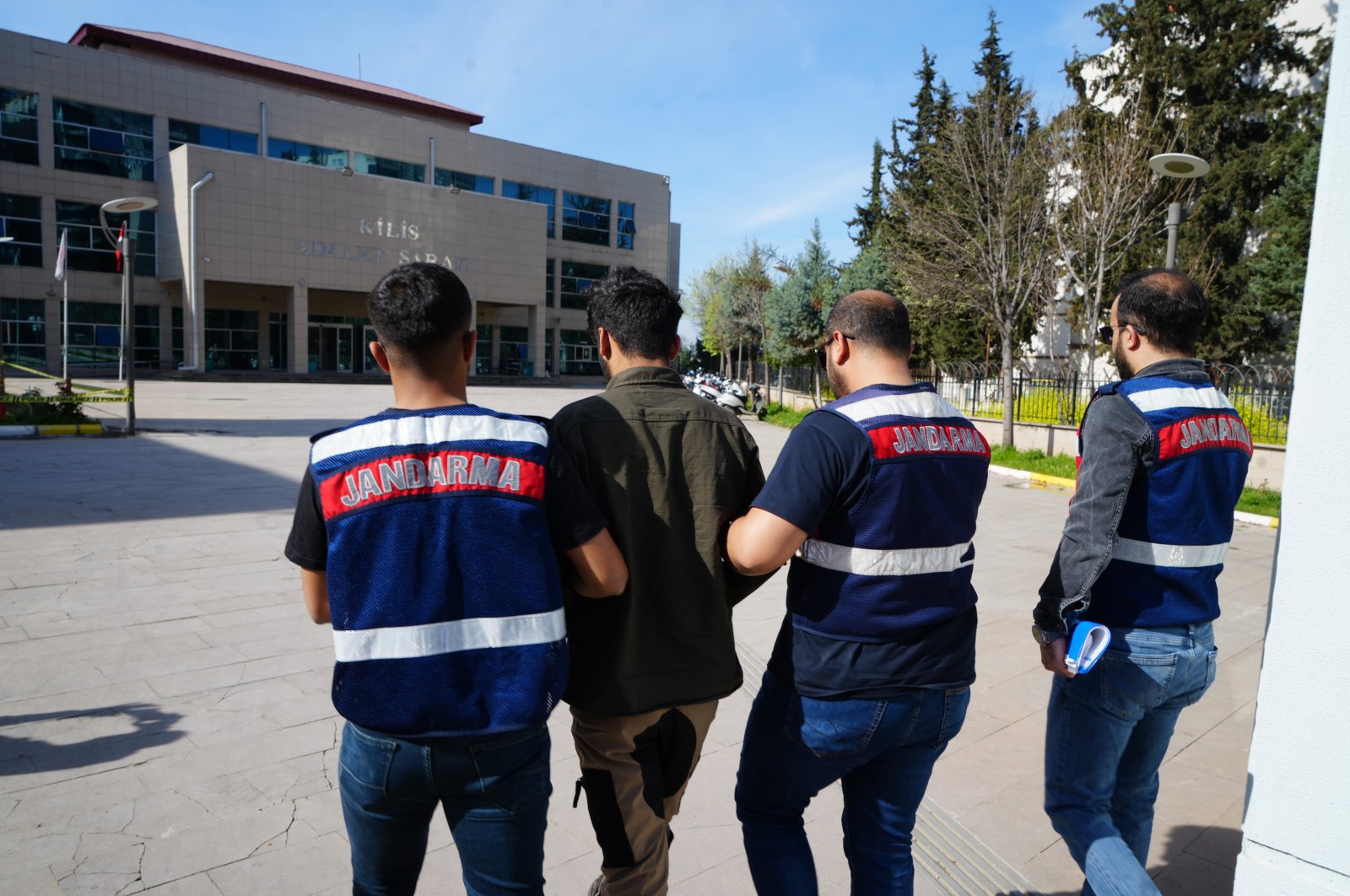 Gendarmerie officers escort to the courthouse a wanted PKK terrorist caught in a raid in southeastern Kilis province, Türkiye, April 3, 2024. (IHA Photo)