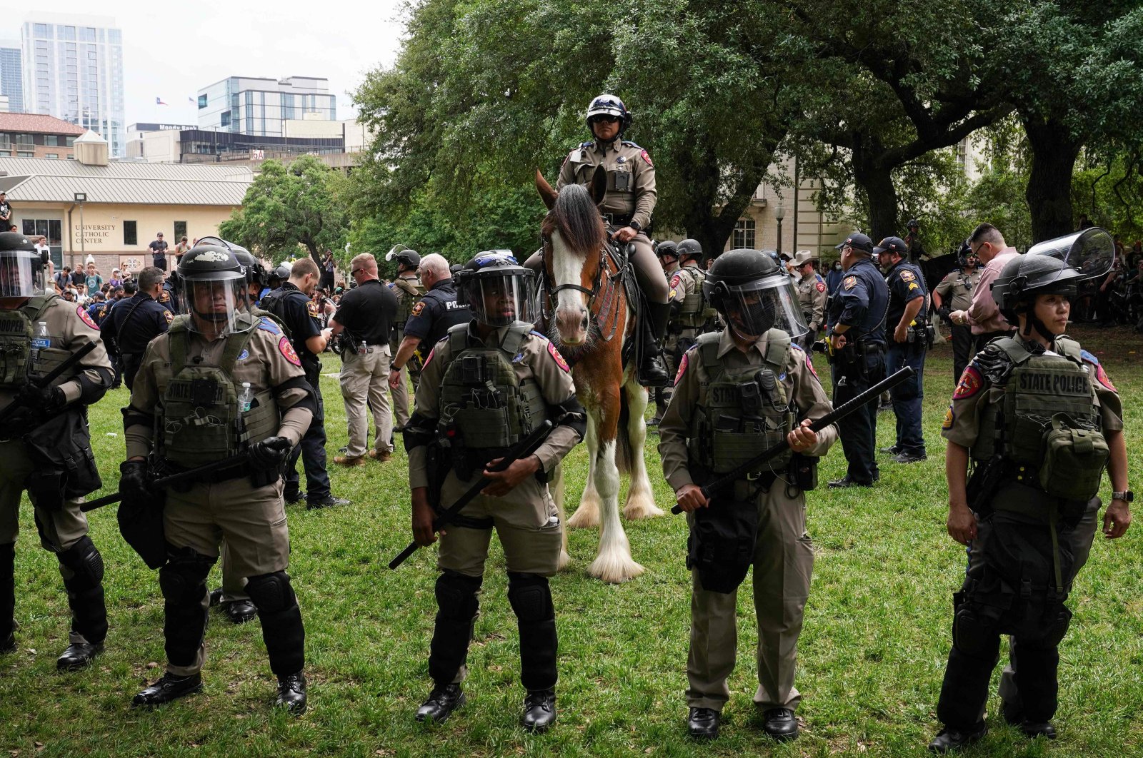 Texas State Troopers and other members of law enforcement monitor the scene as pro-Palestinian students protest Israel's massacres on the campus of the University of Texas in Austin, Texas, on April 24, 2024. (AFP Photo)