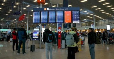 Passengers look at the flight board where many flights were canceled due to a strike, Orly airport, outside Paris, France, April 25, 2024. (AFP Photo)