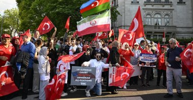 Turks and Azerbaijanis wave Turkish and Azerbaijani flags and banners as they counter-protest a group of Armenians that condemned the 1915 events in Ottoman Türkiye, in front of the Turkish Embassy, Washington D.C., U.S., April 24, 2024. (AA Photo)