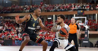 Fenerbahçe Beko's Scottie Wilbekin (R) in action with Monaco's Jaron Blossomgame during the Turkish Airlines EuroLeague playoff series opener at the Salle Gaston Medecin, Monaco, Monaco, April 24, 2024. (IHA Photo)