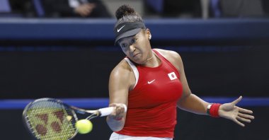 Naomi Osaka returns a shot against Yulia Putintseva during their Billie Jean King Cup tennis match, Tokyo, Japan, April 12, 2024. (AP Photo)
