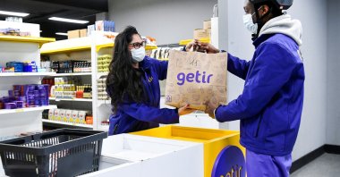 A courier picks up an order at a store of the fast grocery deliverer Getir, Amsterdam, Netherlands, Feb. 8, 2022. (Reuters Photo)