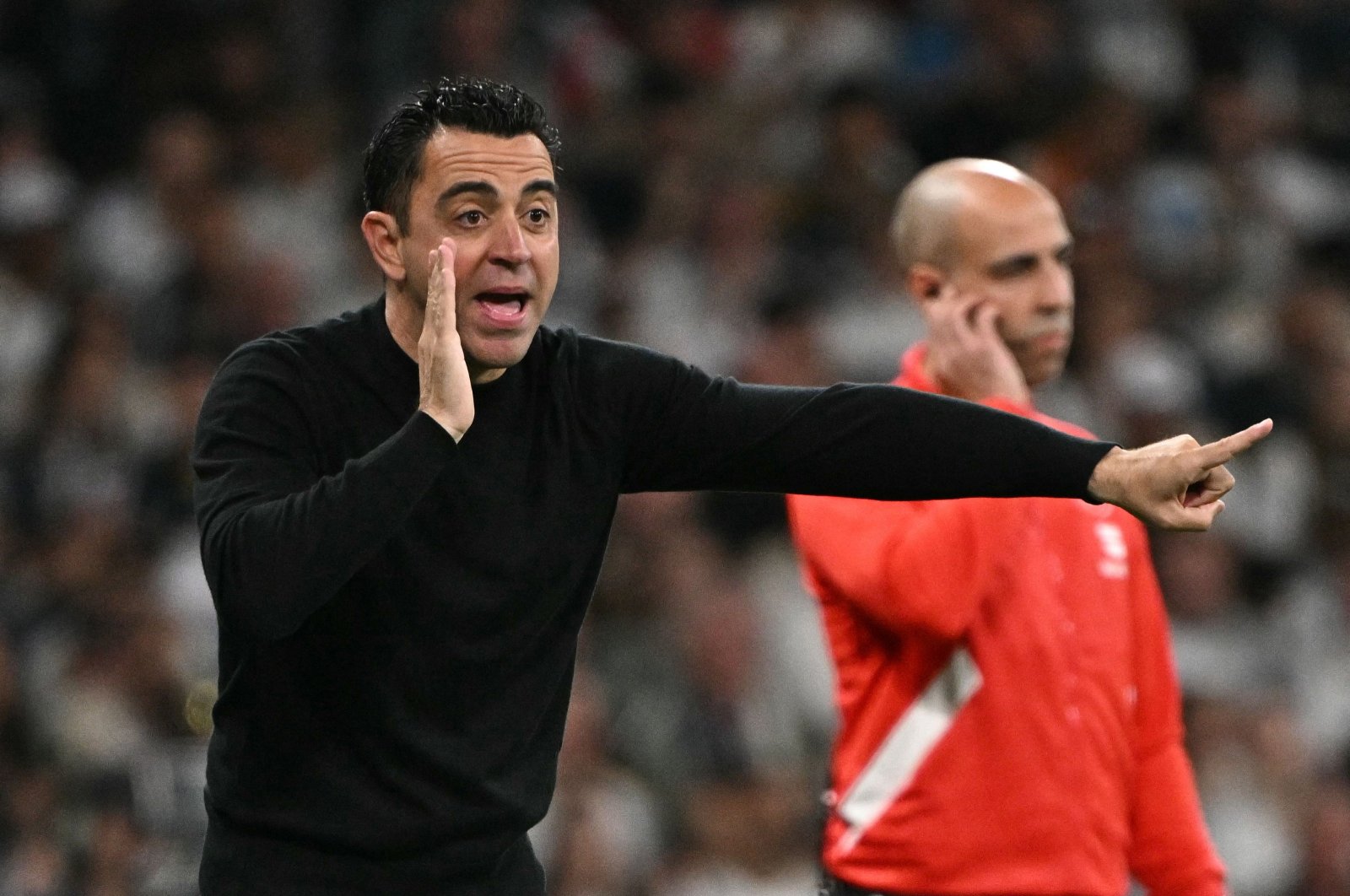 Barcelona&#039;s coach Xavi gestures on the touchline during the Spanish league football match against Real Madrid at the Santiago Bernabeu stadium, Madrid, Spain, April 21, 2024. (AFP Photo)