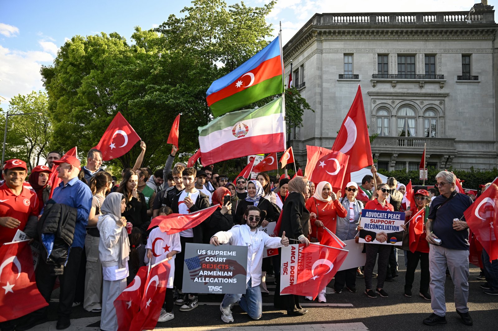 Turks and Azerbaijanis wave Turkish and Azerbaijani flags and banners as they counter-protest a group of Armenians that condemned the 1915 events in Ottoman Türkiye, in front of the Turkish Embassy, Washington D.C., U.S., April 24, 2024. (AA Photo)
