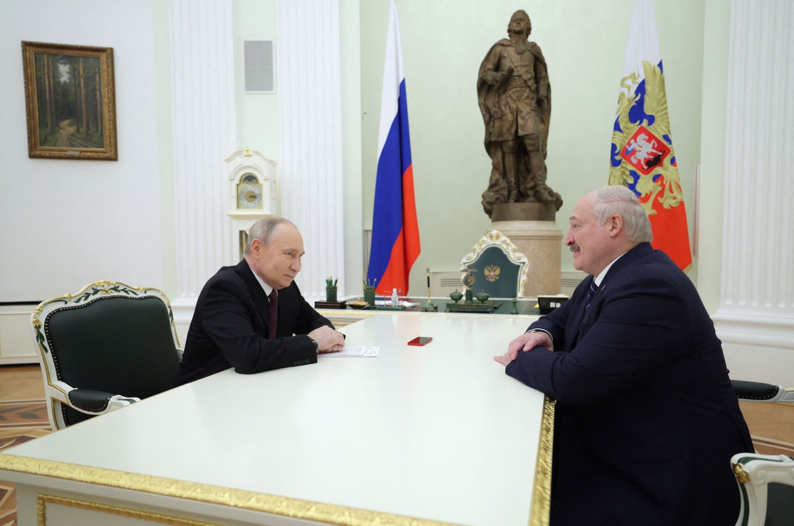 Russia&amp;amp;#039;s President Vladimir Putin and his Belarusian counterpart Alexander Lukashenko speak at the Kremlin in Moscow on April 12, 2024. (AFP File Photo)