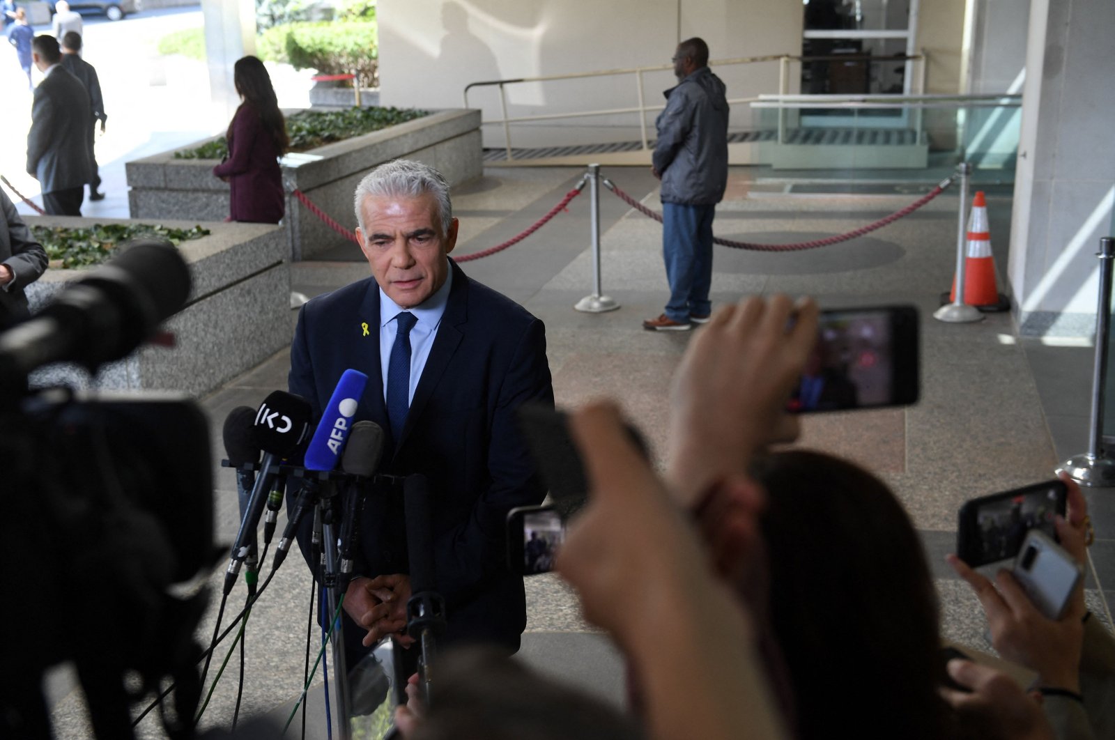 Israeli opposition leader Yair Lapid speaks to reporters after meeting with U.S. Secretary of State Antony Blinken at the US State Department on April 8, 2024 in Washington, D.C. (AFP Photo)