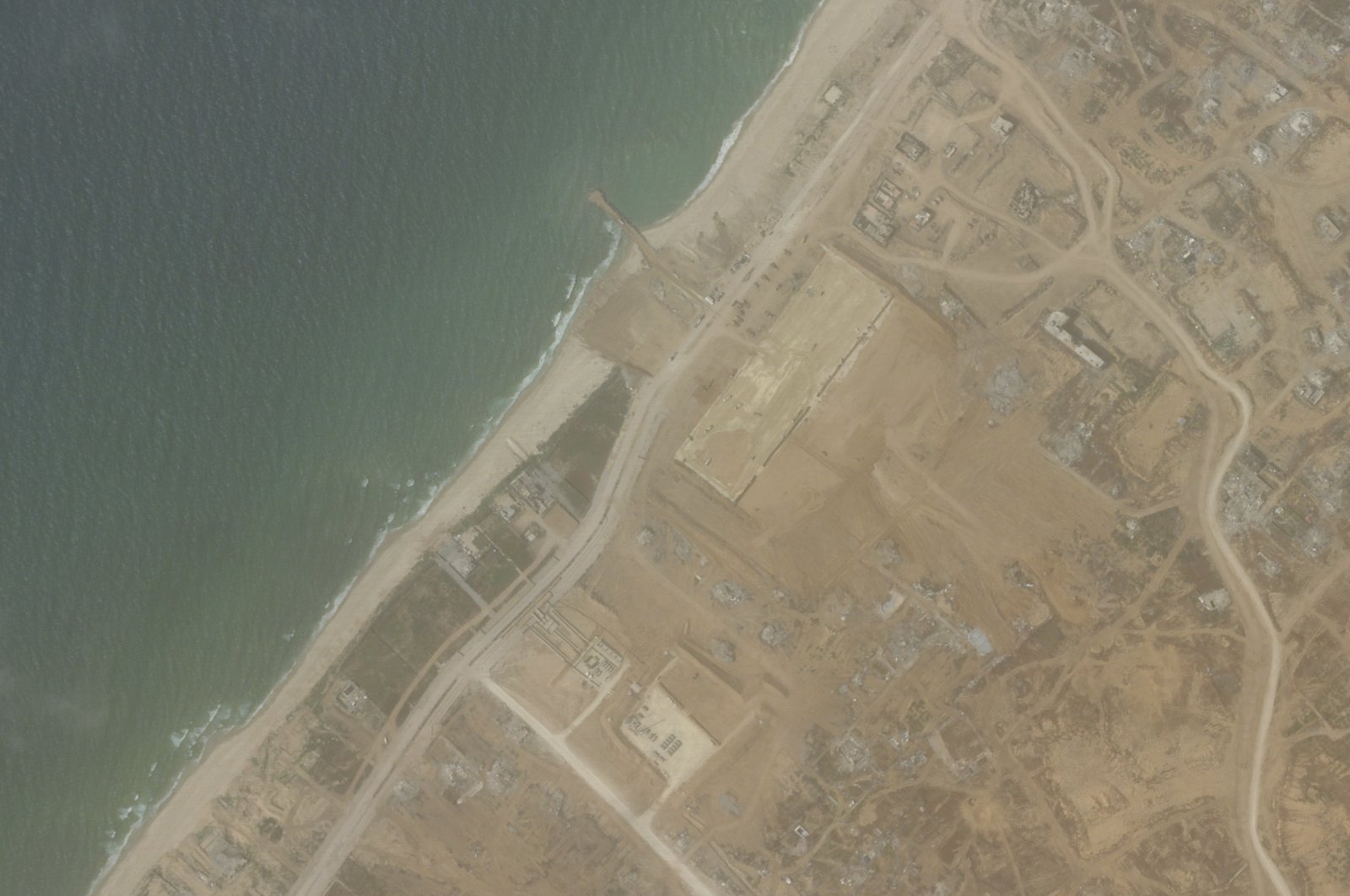 This satellite picture taken by Planet Labs PBC shows the construction of a new aid port near Gaza City, Gaza Strip, April 18, 2024. (AP Photo)