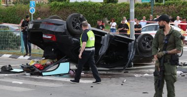 Israeli police cordon off the site of a car accident, where Israeli minister Itamar Ben-Gvir was lightly hurt after his car was involved in an accident, in Ramla south of Tel Aviv, on April 26, 2024. (AFP Photo)