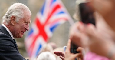 Britain&#039;s King Charles III  meets members of the public, some waving Union flags, during a visit Kinneil House in Edinburgh, Scotland on July 3, 2023. (AFP File Photo)