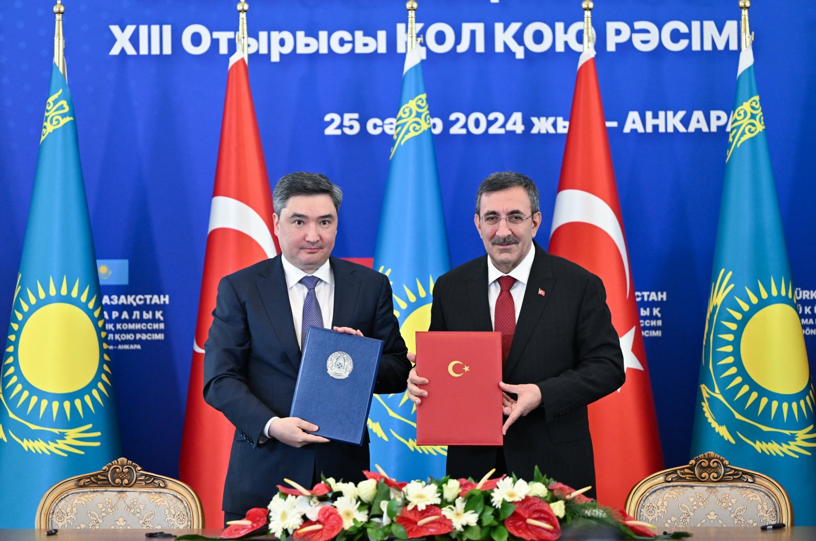 Vice President Cevdet Yılmaz (R) and Kazakh Prime Minister Oljas Bektenov after a signing ceremony in Ankara, Türkiye, April 25, 2024. (AA Photo)